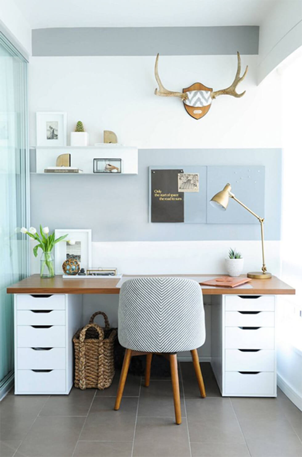 Home office with light blue walls, white walls and wooden accents