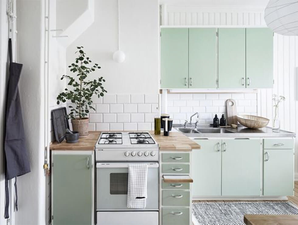 Sage kitchen with white walls