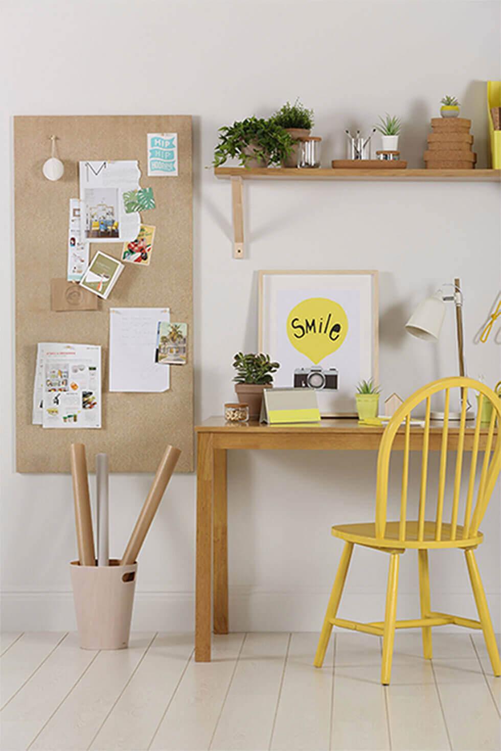 Home office with oak dining table and yellow chair