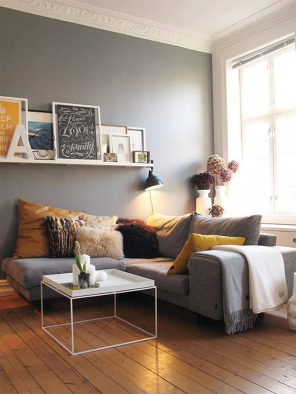 Grey corner sofa in a small living room.