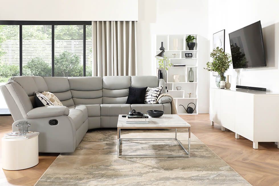 Modern living room with a recliner corner sofa and white coffee table