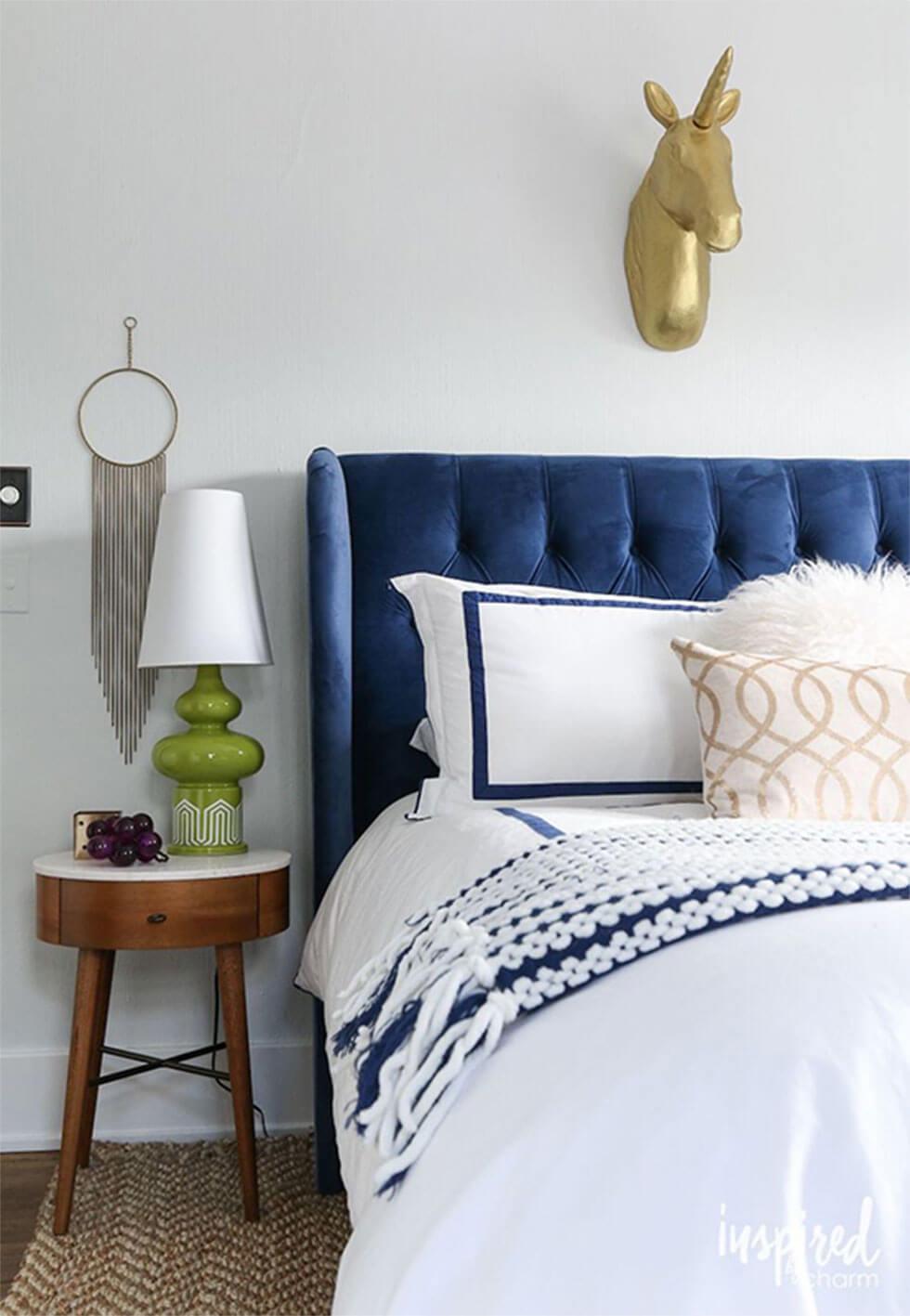 Classic Blue velvet headboard in bedroom with blue and white accents