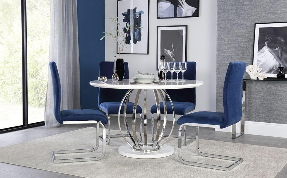 White high gloss table with chrome legs with blue chrome chairs in the dining room