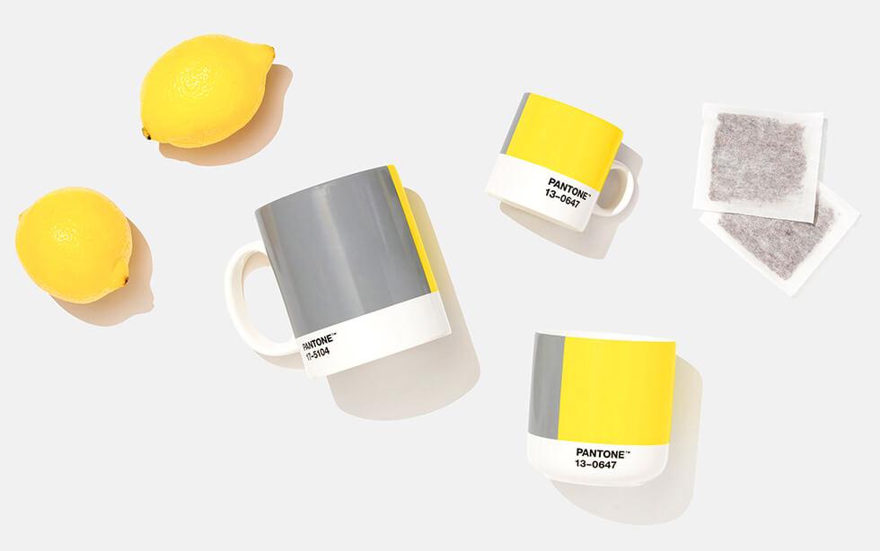 Flat lay of lemons, Pantone mugs and tea bags