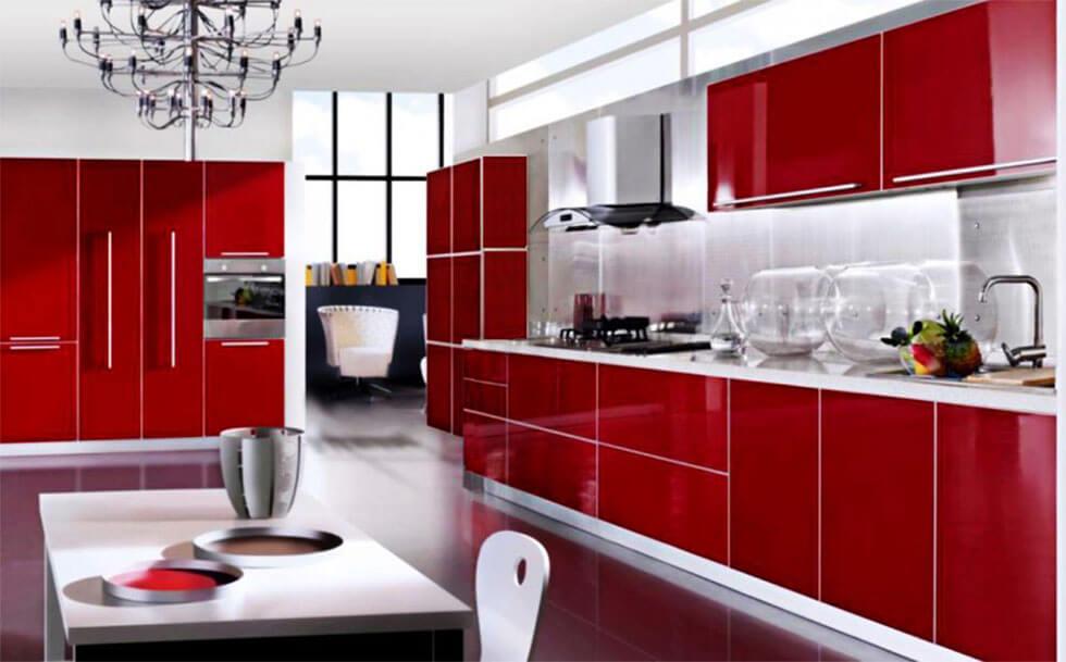 Clean and modern ruby red kitchen with glossy finish cabinets