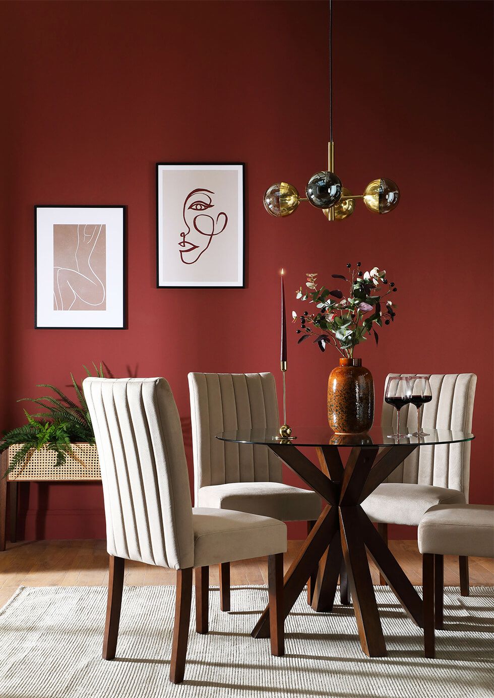 Glass and oak dining table with chic velvet chairs in a timeless dining room