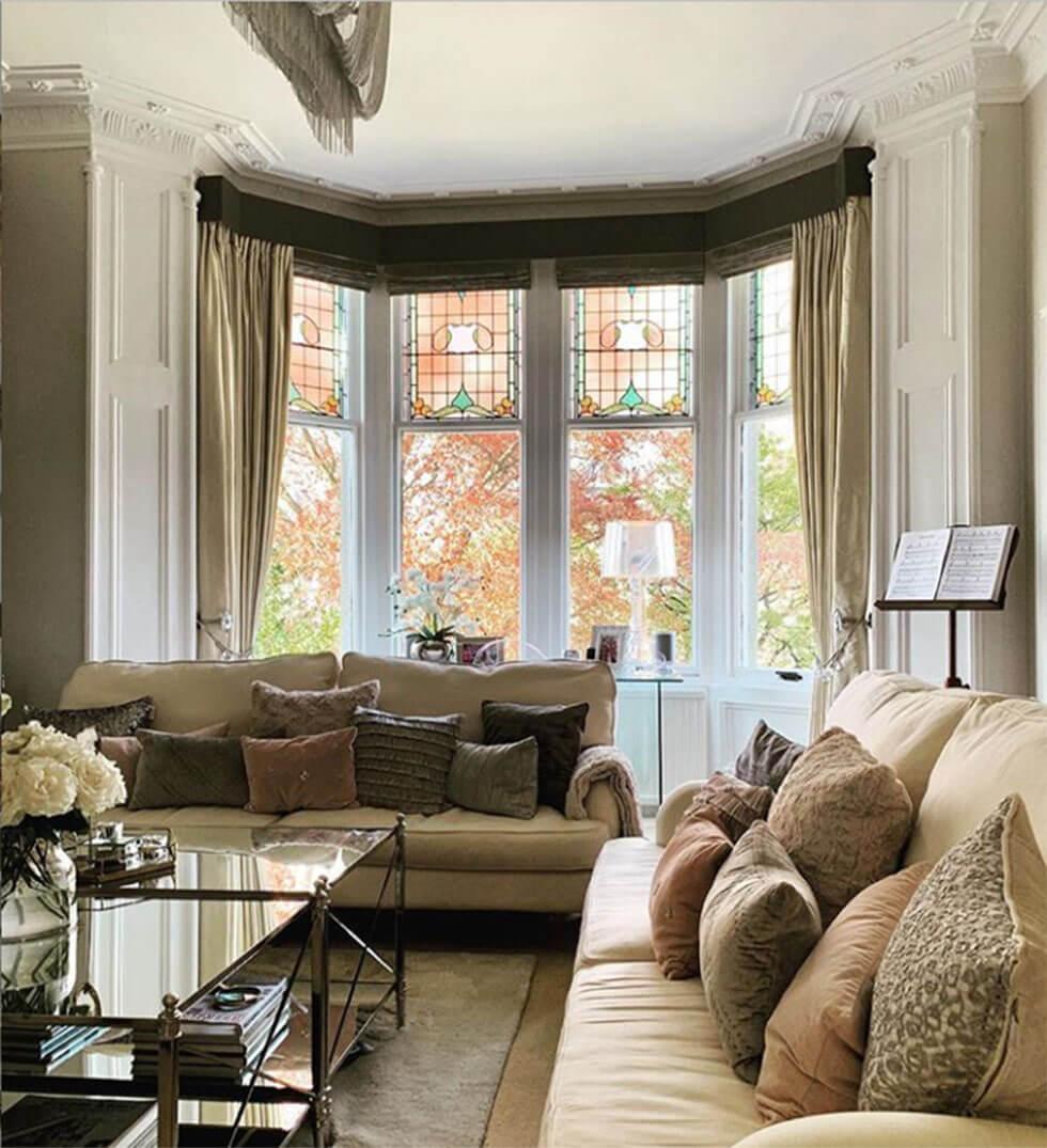 Neutral living room with beige sofa set and cosy cushions