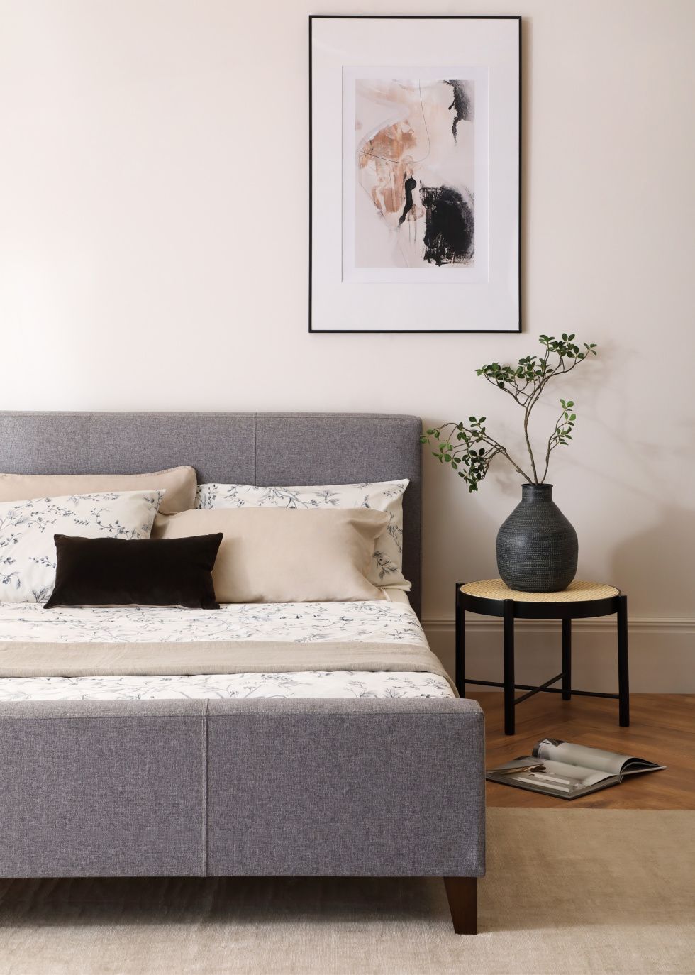 Grey fabric bed in a Japandi bedroom