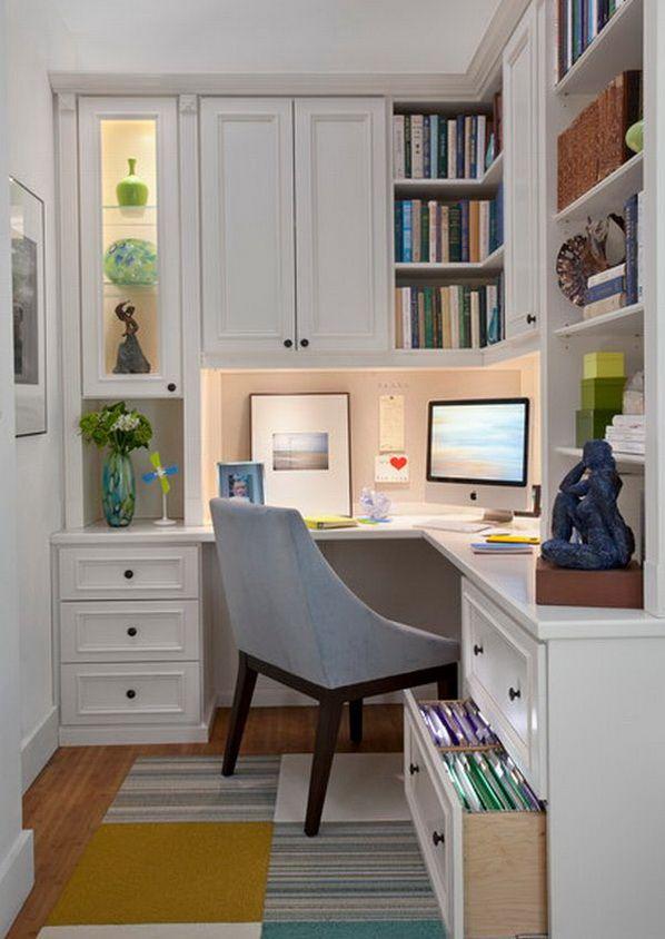 Office nook with white cupboards and grey chair.