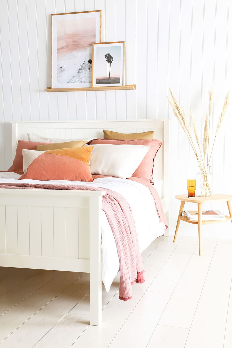 White minimalist bedroom with pops of colour