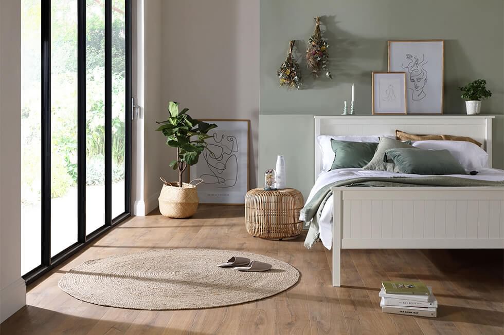 Minimalist bedroom with indoor greenery and natural elements