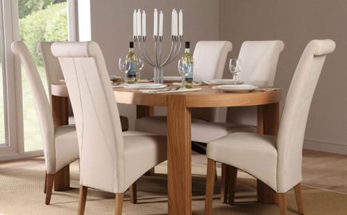 Wood dining set with white leather chairs.