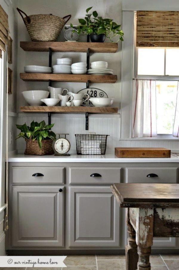 Grey and white kitchen with wooden shelves