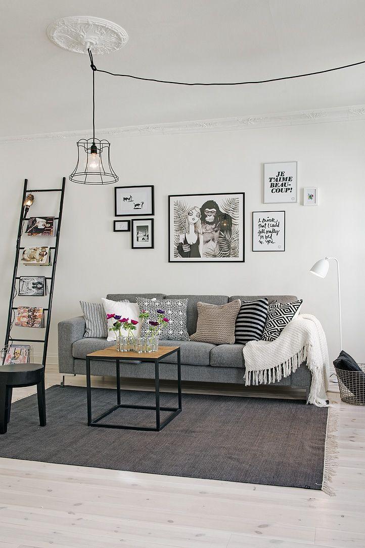 Grey sofa with minimal, industrial black and white decor