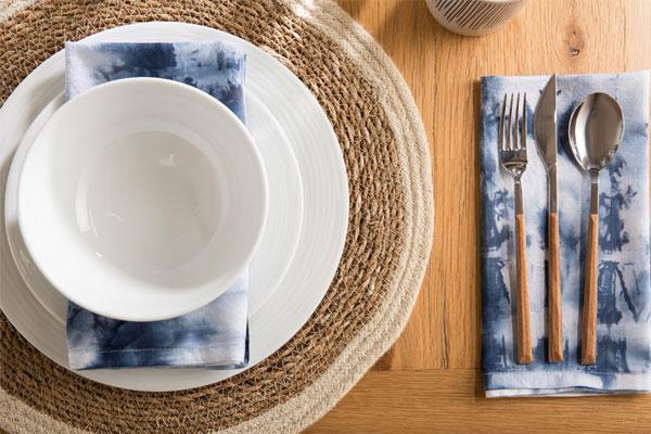 dining flat lay with blue napkins