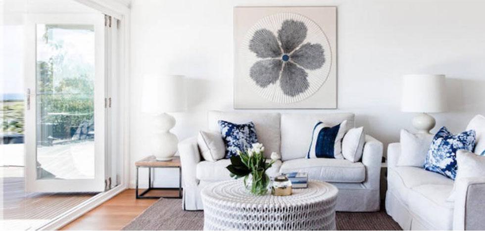 White living room furniture with blue cushions
