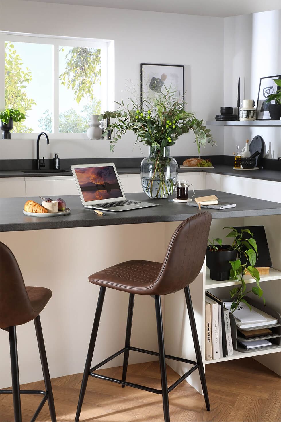 Kitchen island and brown bar stools in a sleek kitchen