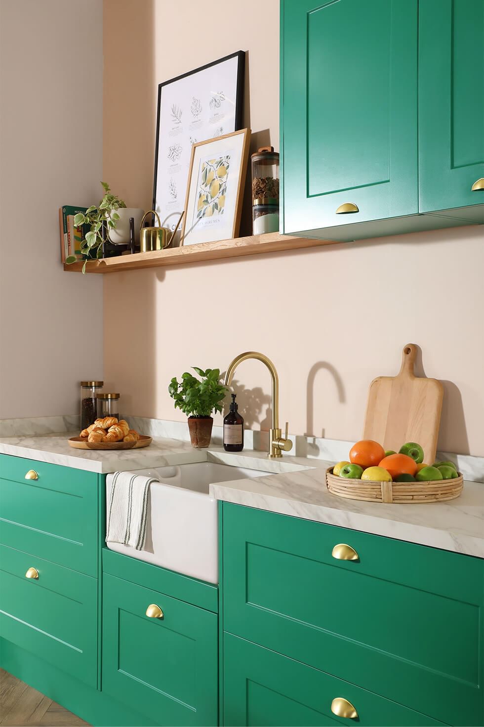 Vibrant green kitchen cabinets with gold hardware