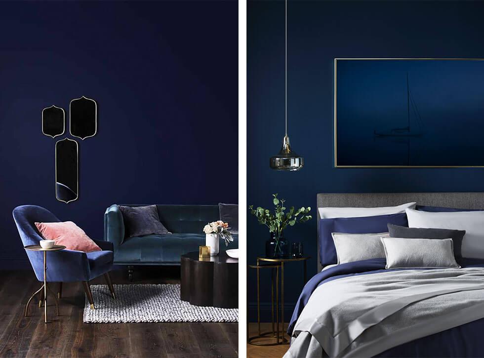 Rich blue rooms with dark matching sofas and bed.