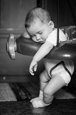 Black and white photograph of a sleeping baby.