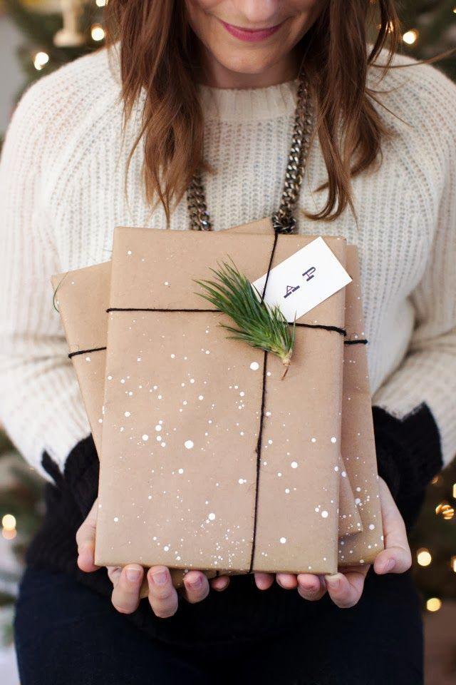 Girl holding two wrapped presents.