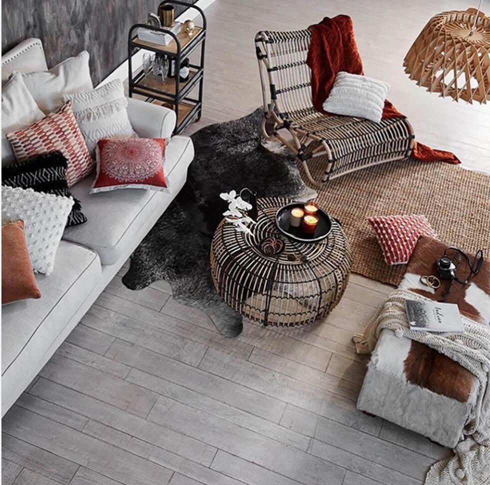 Rustic living room with rattan accessories and cosy fabrics