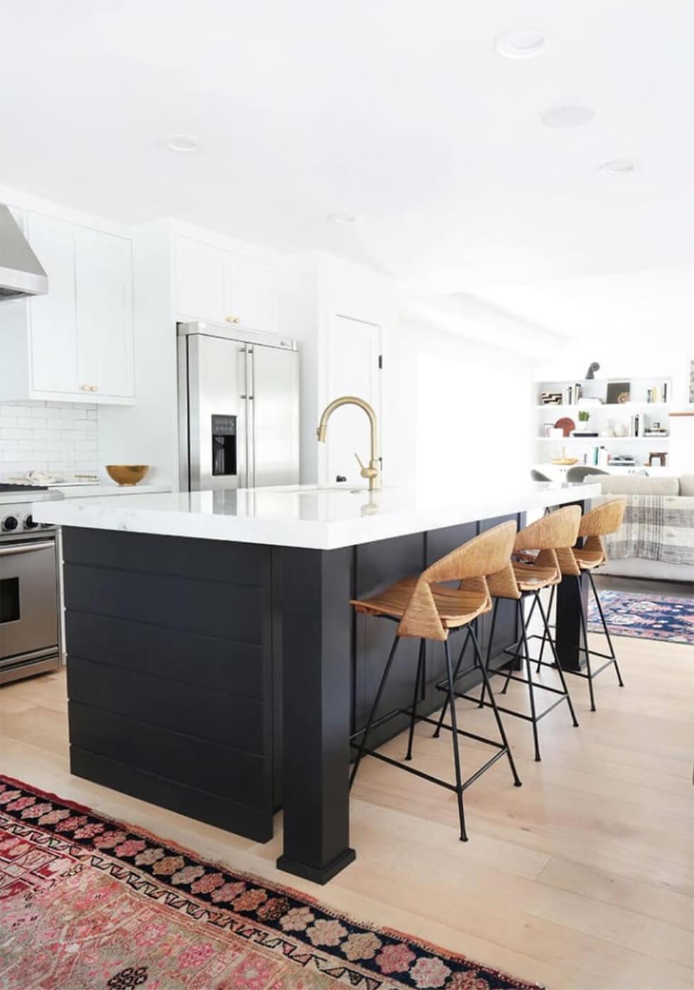 Contemporary kitchen with rattan bar stools