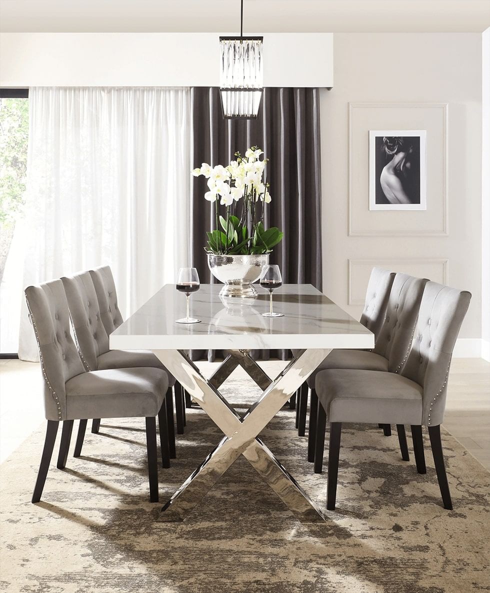 A rug under an elegant dining set in a formal dining room