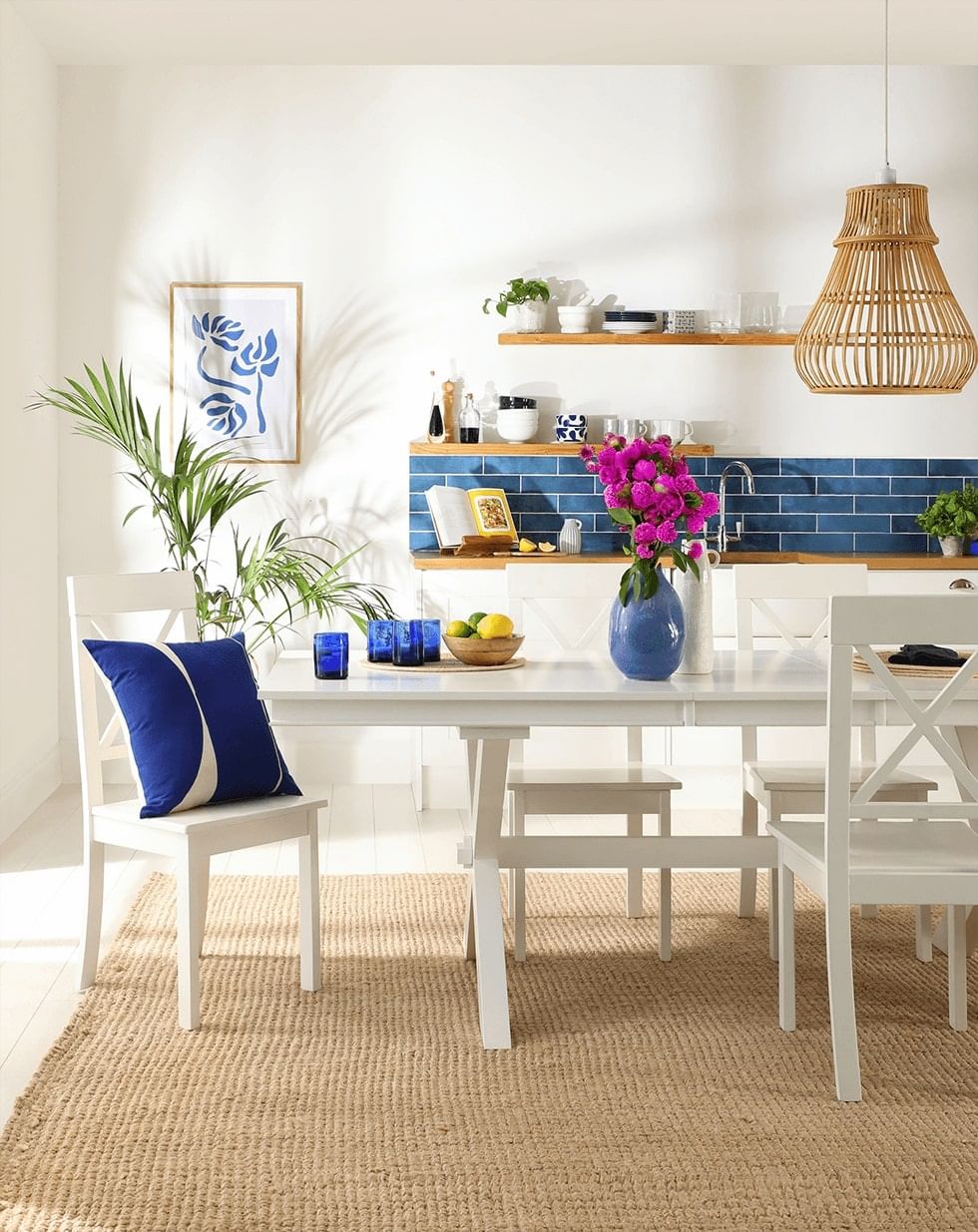 A rug under a white dining set