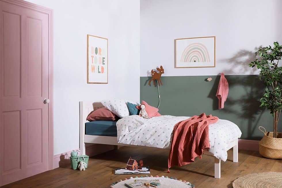 Girls corner of shared bedroom with feature wall and single bed