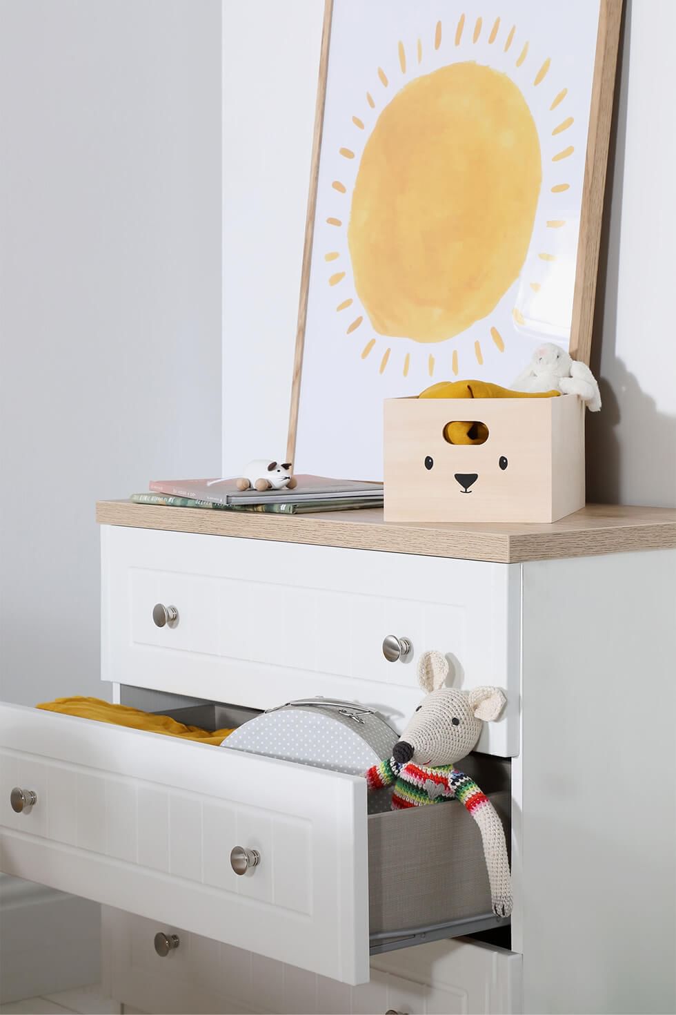 Chest of drawers with toys in a shared bedroom