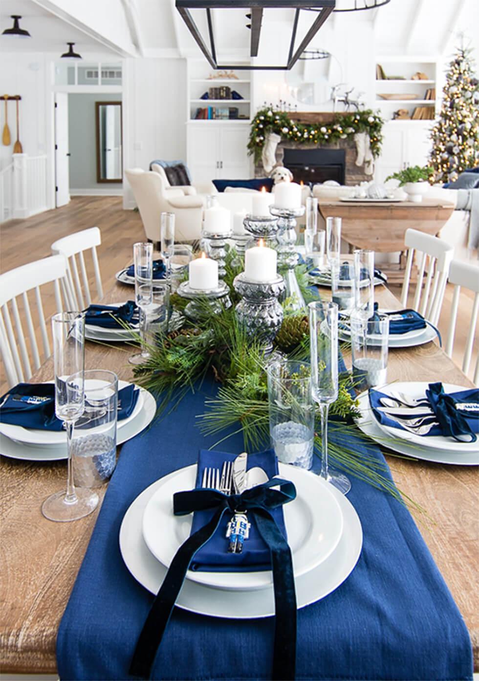 Wooden dining table with blue and white settings