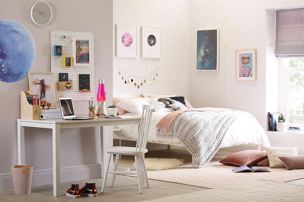 A white bedroom with space and superhero décor.