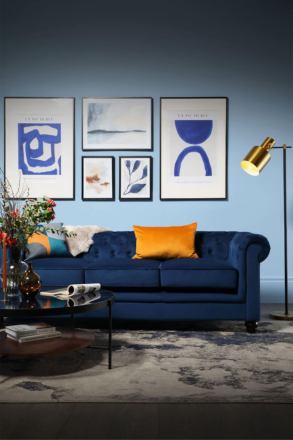 Velvet blue sofa in a modern living room