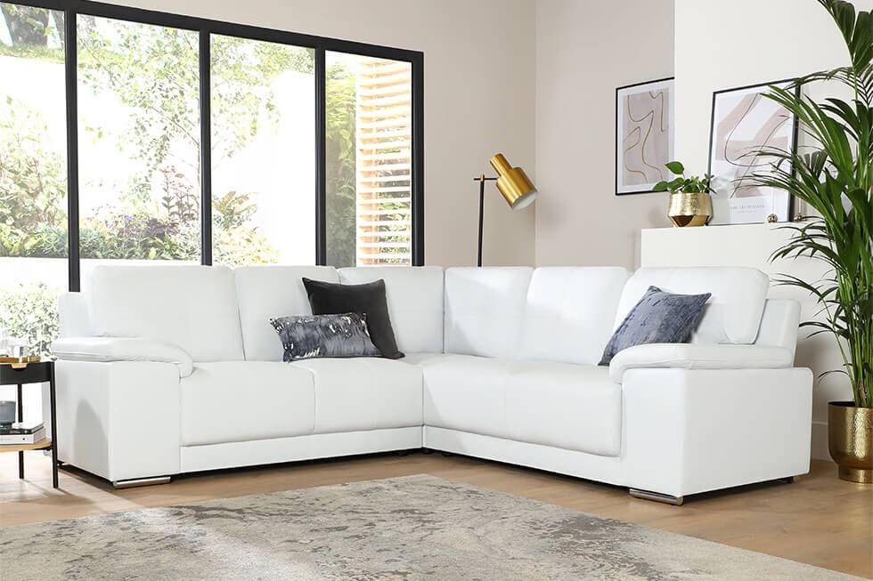 Statement white faux leather corner sofa in the living room