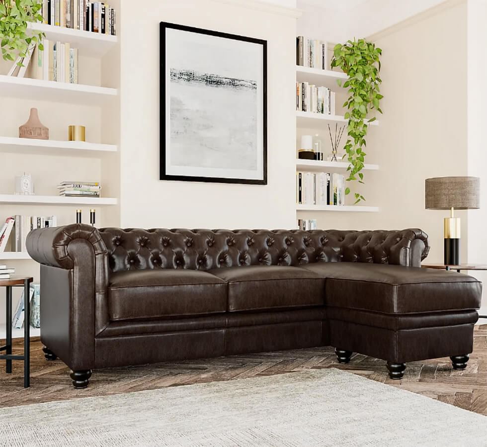A classic dark brown leather Chesterfield L-shape corner sofa in a modern luxe living room