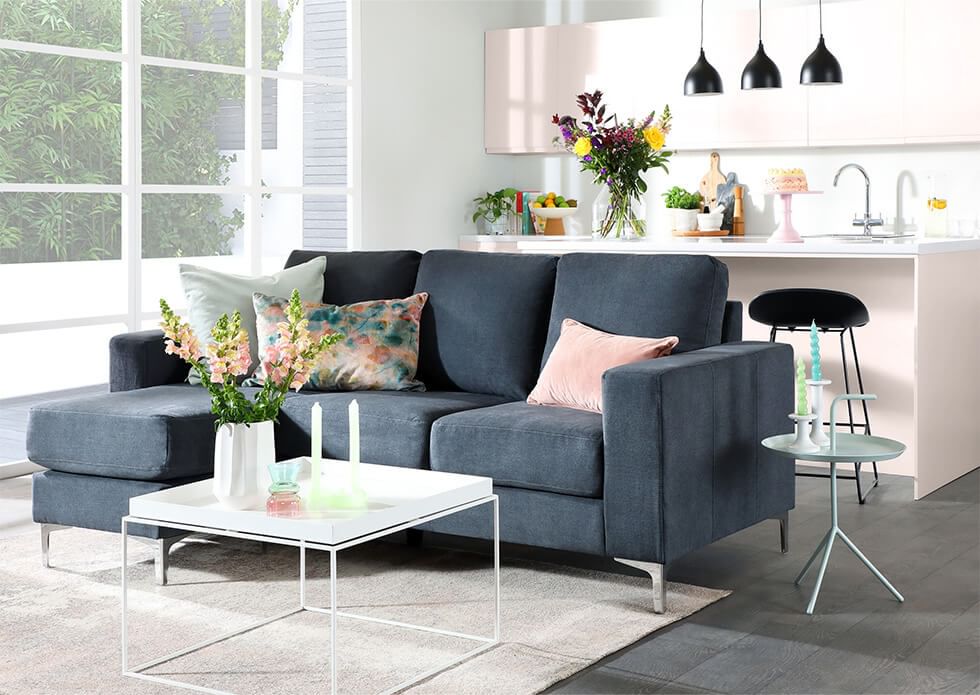 A stylish, comfy grey fabric L-shape corner sofa in a modern living room