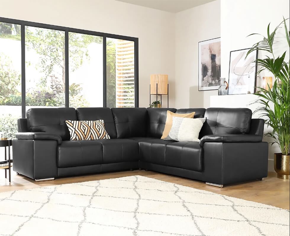 A stylish and comfy black corner sofa in a modern living room