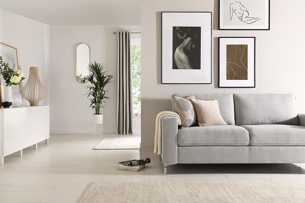 A modern, stylish grey plush fabric sofa in a clean, minimalist design