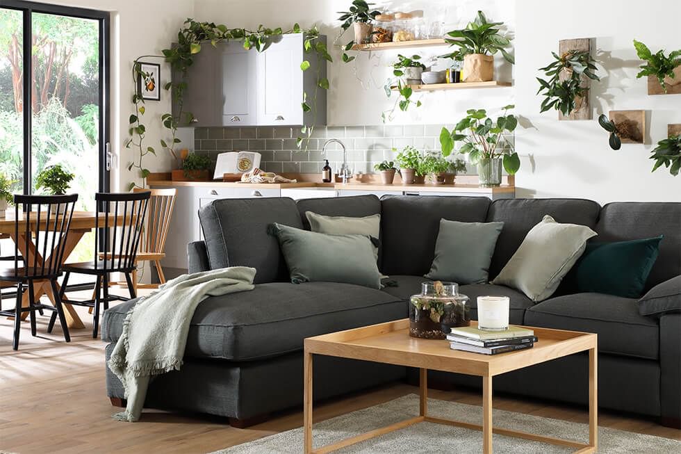 A comfortable dark grey L shape corner sofa for lounging or curling up in