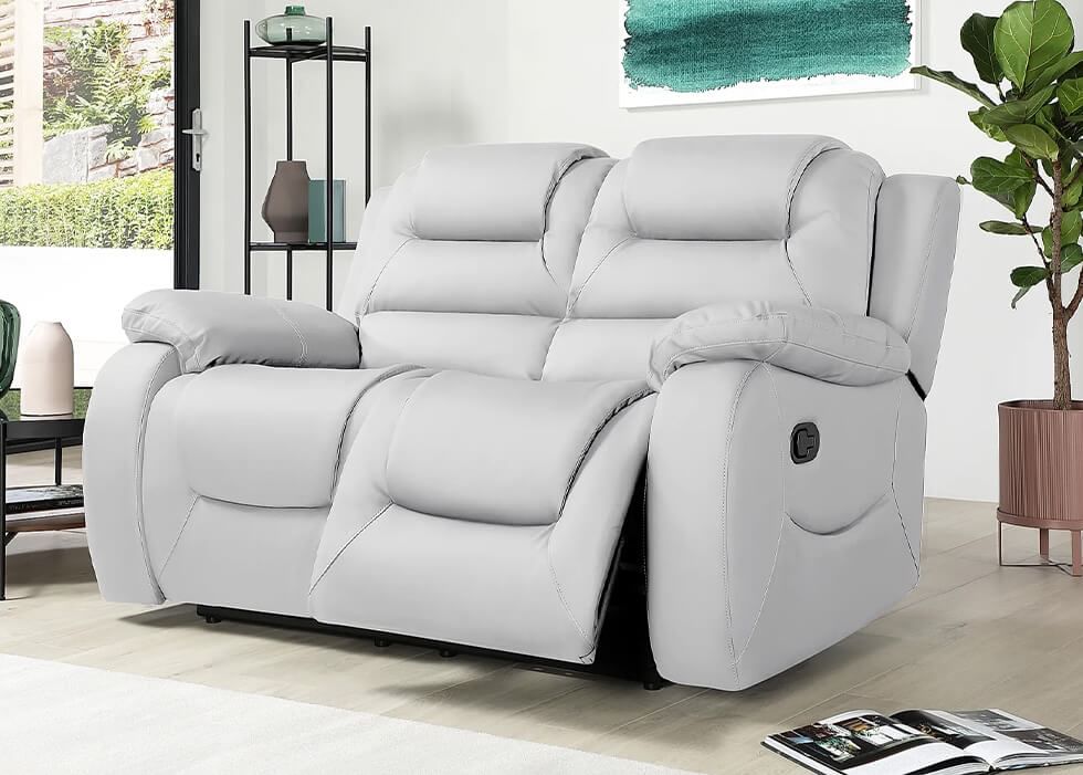 A comfortable 2 seater reclining sofa in light grey leather