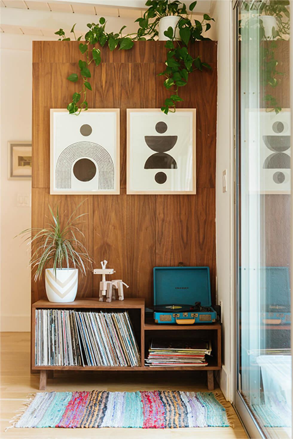 Vintage room with wood panels, mid-century art and indoor plants