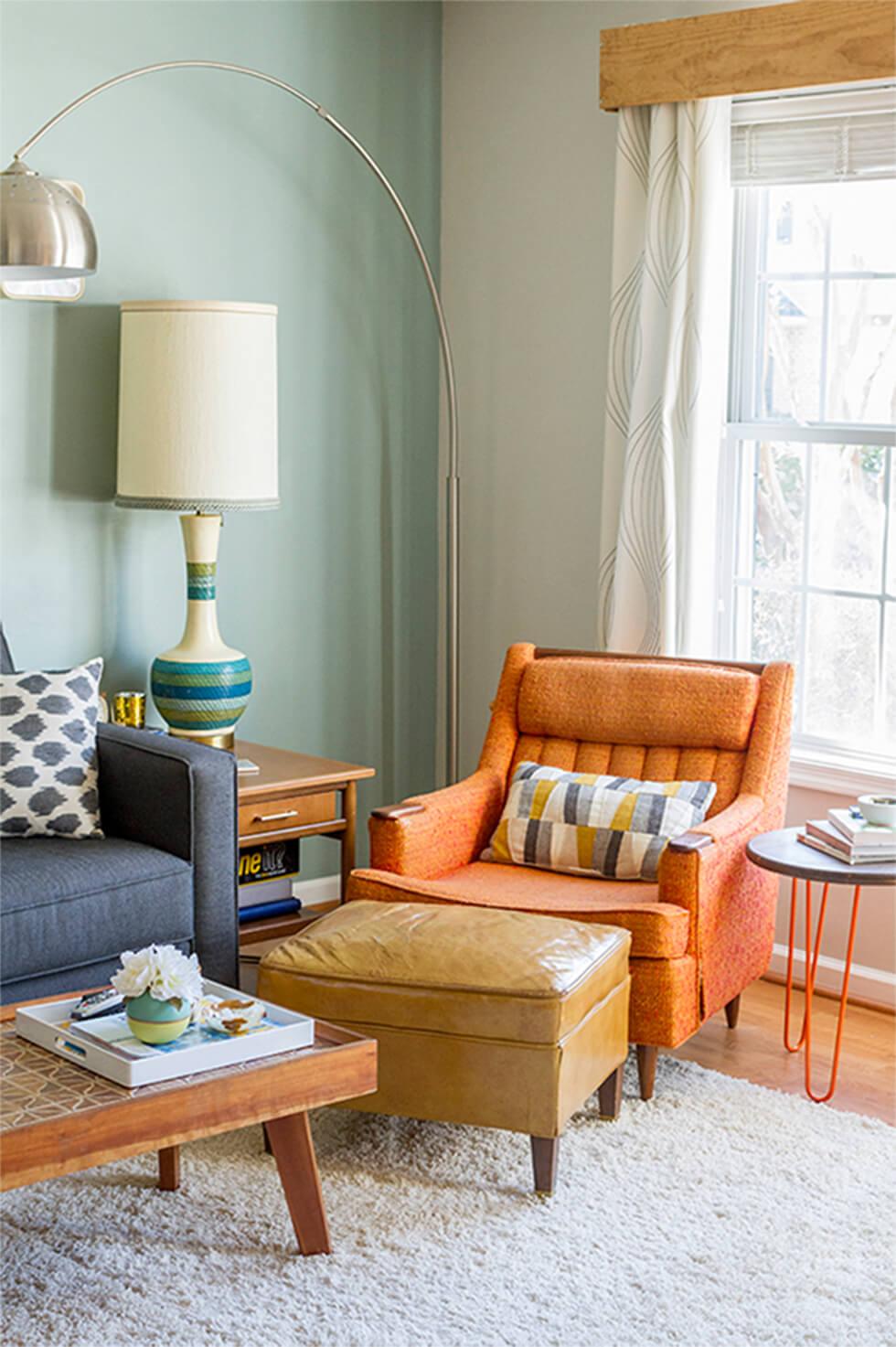 Cosy mid-century living room with orange armchair