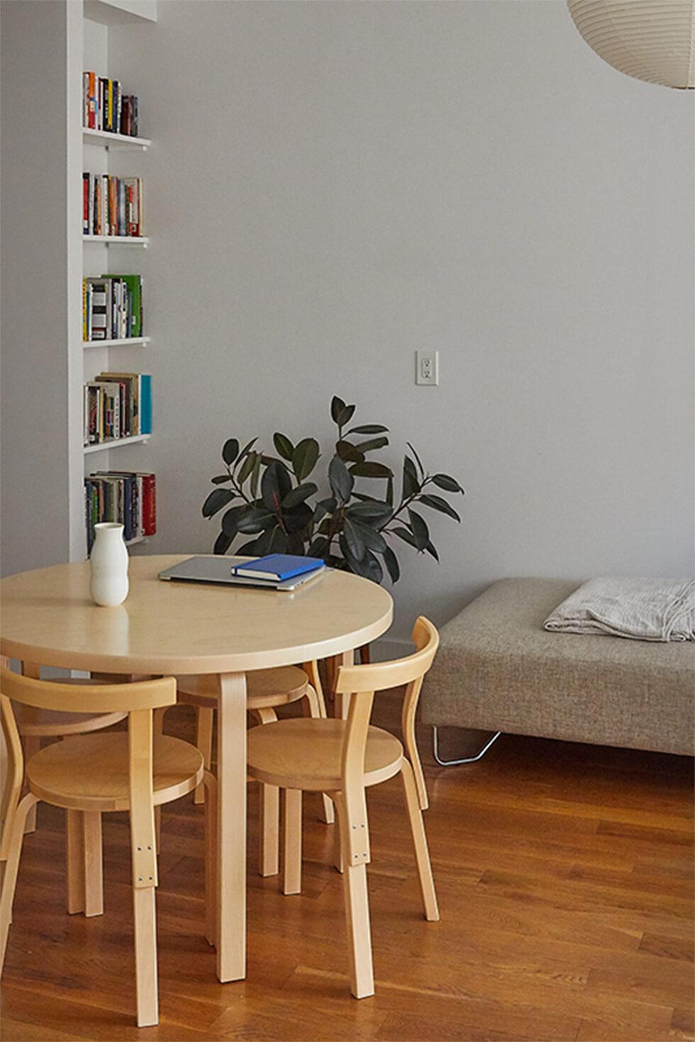 Minimal dining room with modular round wooden dining set