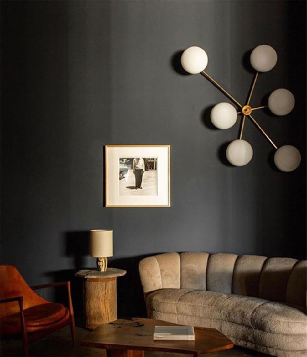 Living room with statement pendant lighting and neutral furniture