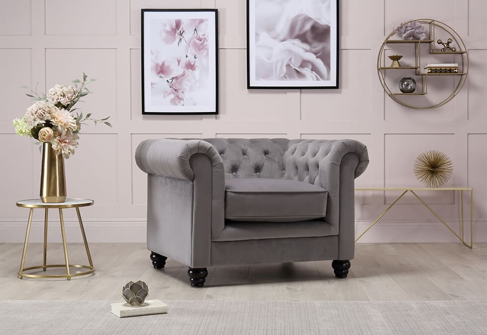 Grey armchair in a pink living room