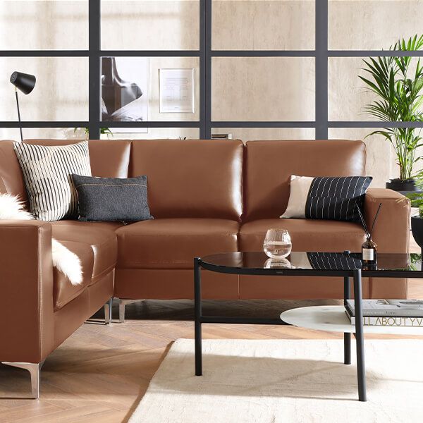 4 modern ways to style a brown sofa