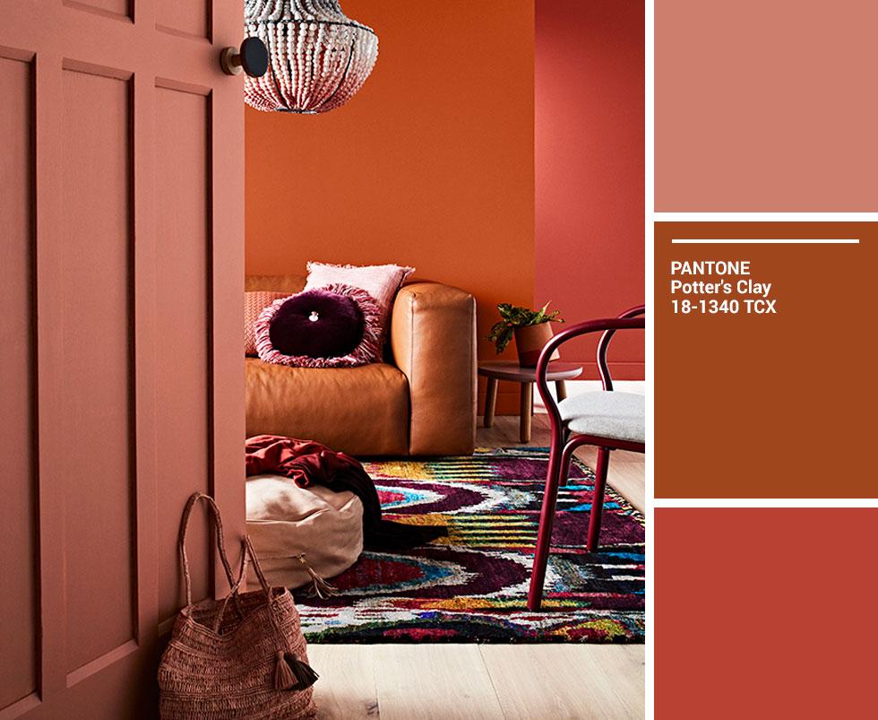 A living room in varying shades of orange, brown and red. 