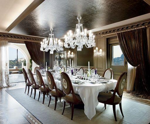 Grand dining room with two statement chandeliers. 