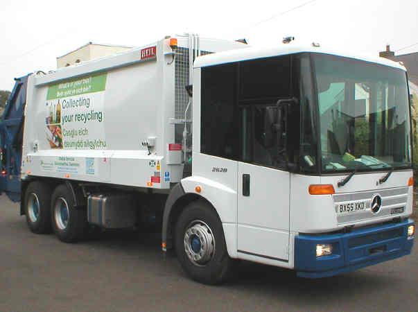 White truck that collects unwanted furniture for recycling.